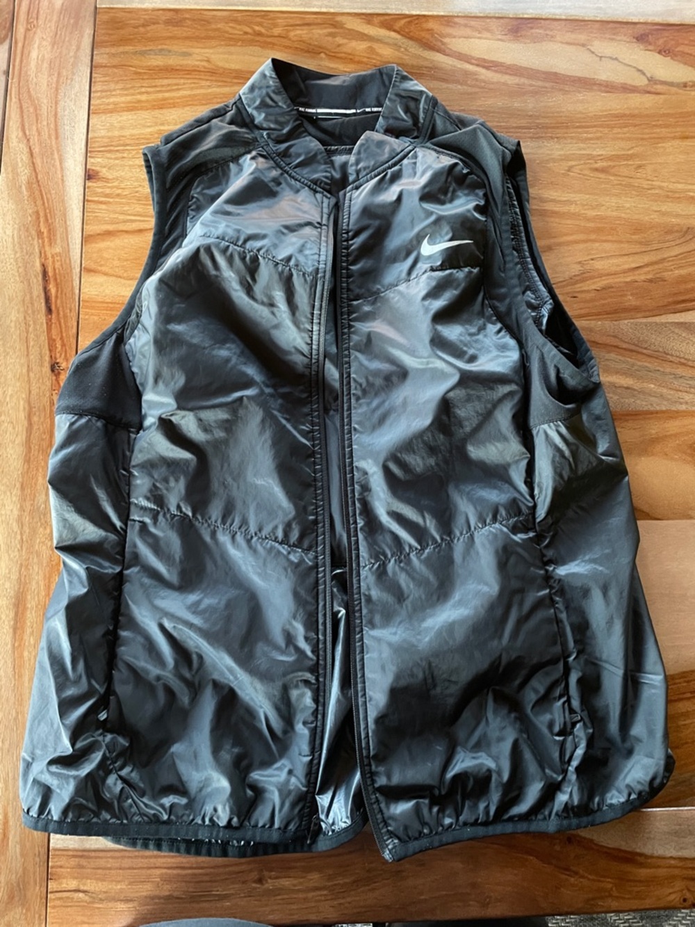 Nike Black Quilted Sleeveless Puffer Vest with White Swoosh